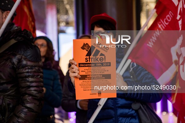 Employees of the well-known clothing brand Adidas protest in front of the Adidas store in Milan against the 41 dismissals due to the relocat...