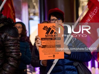 Employees of the well-known clothing brand Adidas protest in front of the Adidas store in Milan against the 41 dismissals due to the relocat...