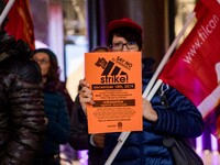 Employees of the well-known clothing brand Adidas protest in front of the Adidas store in Milan against the 41 dismissals due to the relocat...