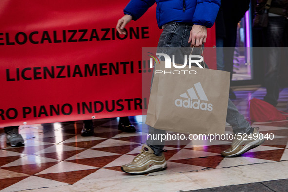 Employees of the well-known clothing brand Adidas protest in front of the Adidas store in Milan against the 41 dismissals due to the relocat...