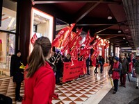 Employees of the well-known clothing brand Adidas protest in front of the Adidas store in Milan against the 41 dismissals due to the relocat...