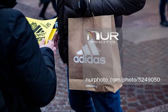 Employees of the well-known clothing brand Adidas protest in front of the Adidas store in Milan against the 41 dismissals due to the relocat...