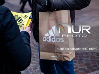 Employees of the well-known clothing brand Adidas protest in front of the Adidas store in Milan against the 41 dismissals due to the relocat...