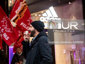 Employees of the well-known clothing brand Adidas protest in front of the Adidas store in Milan against the 41 dismissals due to the relocat...