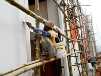 Bangladeshi day labor works at the construction site of Dhaka international Trade Fair in Dhaka, Bangladesh, on December 26, 2019. (