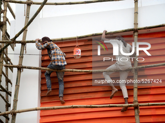 Bangladeshi day labor works at the construction site of Dhaka international Trade Fair in Dhaka, Bangladesh, on December 26, 2019. (