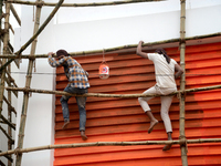 Bangladeshi day labor works at the construction site of Dhaka international Trade Fair in Dhaka, Bangladesh, on December 26, 2019. (