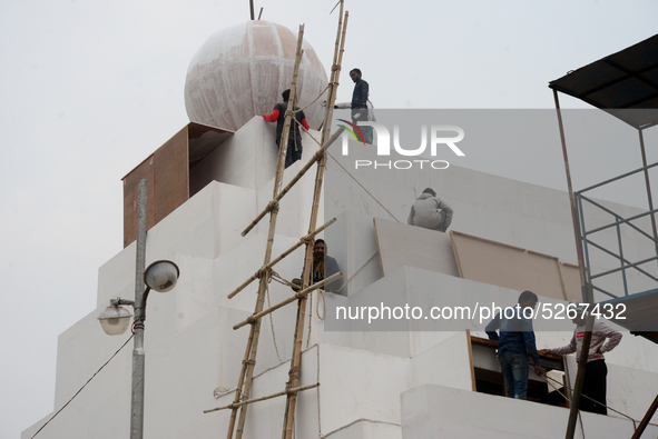 Bangladeshi day labor works at the construction site of Dhaka international Trade Fair in Dhaka, Bangladesh, on December 26, 2019. 