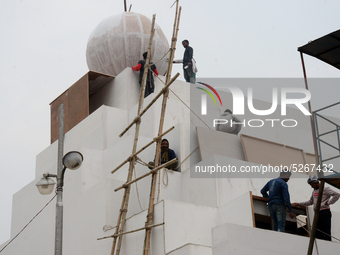 Bangladeshi day labor works at the construction site of Dhaka international Trade Fair in Dhaka, Bangladesh, on December 26, 2019. (