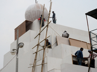 Bangladeshi day labor works at the construction site of Dhaka international Trade Fair in Dhaka, Bangladesh, on December 26, 2019. (