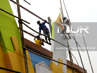 Bangladeshi day labor works at the construction site of Dhaka international Trade Fair in Dhaka, Bangladesh, on December 26, 2019. (