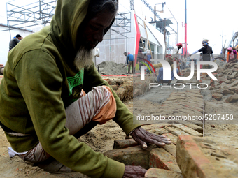 Bangladeshi day labor works at the construction site of Dhaka international Trade Fair in Dhaka, Bangladesh, on December 26, 2019. (