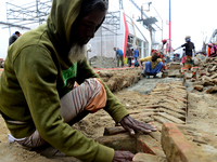 Bangladeshi day labor works at the construction site of Dhaka international Trade Fair in Dhaka, Bangladesh, on December 26, 2019. (