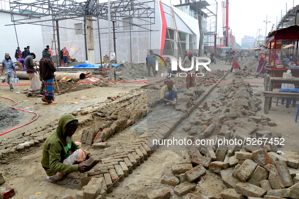 Bangladeshi day labor works at the construction site of Dhaka international Trade Fair in Dhaka, Bangladesh, on December 26, 2019. 