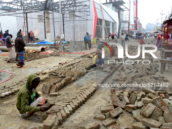 Bangladeshi day labor works at the construction site of Dhaka international Trade Fair in Dhaka, Bangladesh, on December 26, 2019. (