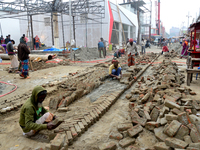 Bangladeshi day labor works at the construction site of Dhaka international Trade Fair in Dhaka, Bangladesh, on December 26, 2019. (