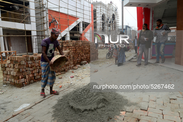 Bangladeshi day labor works at the construction site of Dhaka international Trade Fair in Dhaka, Bangladesh, on December 26, 2019. 