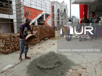 Bangladeshi day labor works at the construction site of Dhaka international Trade Fair in Dhaka, Bangladesh, on December 26, 2019. (