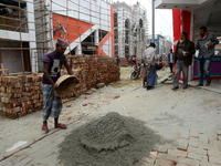 Bangladeshi day labor works at the construction site of Dhaka international Trade Fair in Dhaka, Bangladesh, on December 26, 2019. (