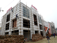 Bangladeshi day labor works at the construction site of Dhaka international Trade Fair in Dhaka, Bangladesh, on December 26, 2019. (