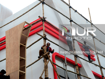 Bangladeshi day labor works at the construction site of Dhaka international Trade Fair in Dhaka, Bangladesh, on December 26, 2019. (