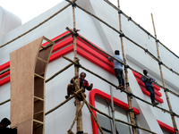 Bangladeshi day labor works at the construction site of Dhaka international Trade Fair in Dhaka, Bangladesh, on December 26, 2019. (