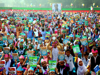 Bangladeshi Students receive free textbooks from government to celebrate on the first day of the New Year in Dhaka on January 1, 2020. The B...