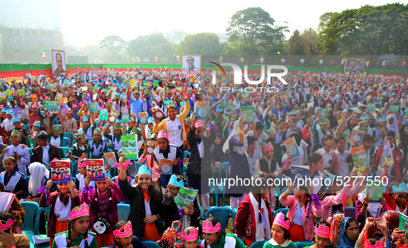 Bangladeshi Students receive free textbooks from government to celebrate on the first day of the New Year in Dhaka on January 1, 2020. The B...