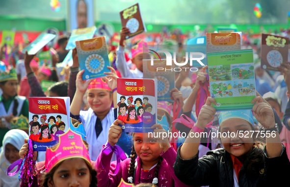 Bangladeshi Students receive free textbooks from government to celebrate on the first day of the New Year in Dhaka on January 1, 2020. The B...