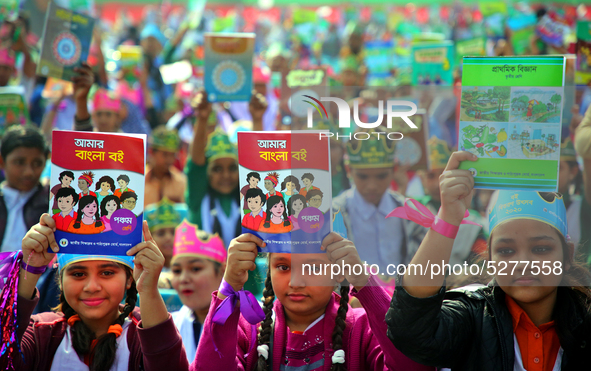 Bangladeshi Students receive free textbooks from government to celebrate on the first day of the New Year in Dhaka on January 1, 2020. The B...