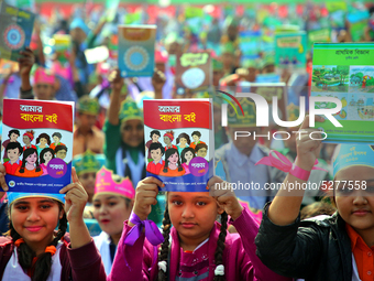 Bangladeshi Students receive free textbooks from government to celebrate on the first day of the New Year in Dhaka on January 1, 2020. The B...