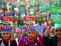 Bangladeshi Students receive free textbooks from government to celebrate on the first day of the New Year in Dhaka on January 1, 2020. The B...