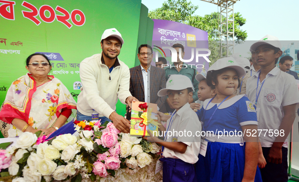 Bangladeshi Students receive free textbooks from government to celebrate on the first day of the New Year in Dhaka on January 1, 2020. The B...