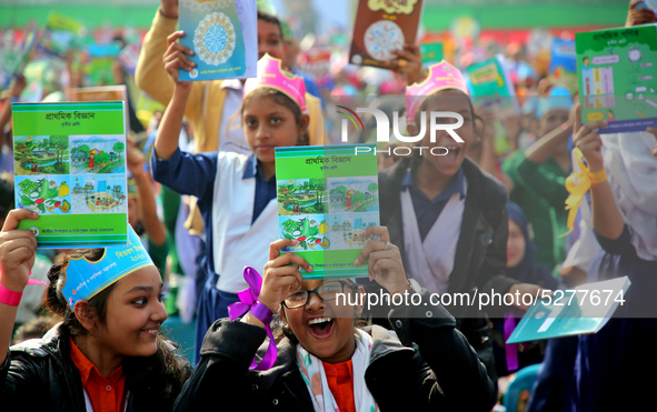 Bangladeshi Students receive free textbooks from government to celebrate on the first day of the New Year in Dhaka on January 1, 2020. The B...