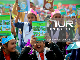 Bangladeshi Students receive free textbooks from government to celebrate on the first day of the New Year in Dhaka on January 1, 2020. The B...