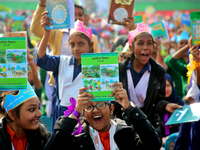 Bangladeshi Students receive free textbooks from government to celebrate on the first day of the New Year in Dhaka on January 1, 2020. The B...