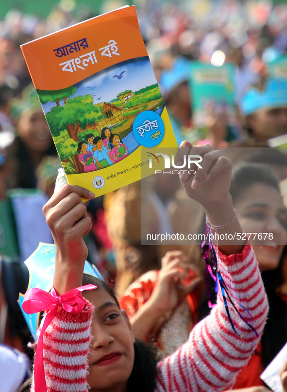 Bangladeshi Students receive free textbooks from government to celebrate on the first day of the New Year in Dhaka on January 1, 2020. The B...