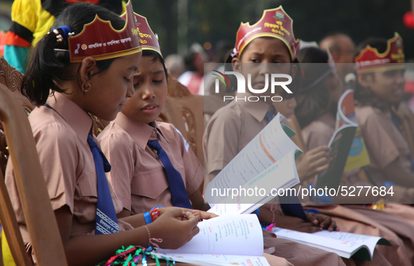 Bangladeshi Students receive free textbooks from government to celebrate on the first day of the New Year in Dhaka on January 1, 2020. The B...