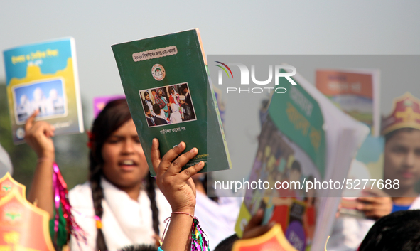 Bangladeshi Students receive free textbooks from government to celebrate on the first day of the New Year in Dhaka on January 1, 2020. The B...