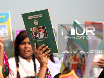 Bangladeshi Students receive free textbooks from government to celebrate on the first day of the New Year in Dhaka on January 1, 2020. The B...