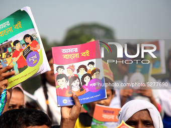 Bangladeshi Students receive free textbooks from government to celebrate on the first day of the New Year in Dhaka on January 1, 2020. The B...