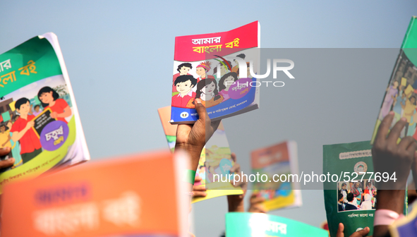 Bangladeshi Students receive free textbooks from government to celebrate on the first day of the New Year in Dhaka on January 1, 2020. The B...