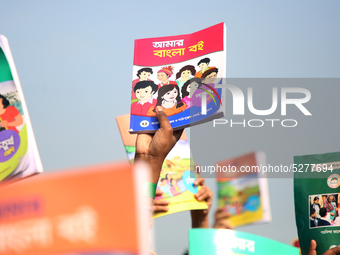 Bangladeshi Students receive free textbooks from government to celebrate on the first day of the New Year in Dhaka on January 1, 2020. The B...