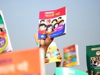 Bangladeshi Students receive free textbooks from government to celebrate on the first day of the New Year in Dhaka on January 1, 2020. The B...