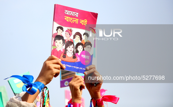 Bangladeshi Students receive free textbooks from government to celebrate on the first day of the New Year in Dhaka on January 1, 2020. The B...