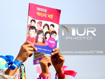 Bangladeshi Students receive free textbooks from government to celebrate on the first day of the New Year in Dhaka on January 1, 2020. The B...