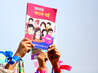 Bangladeshi Students receive free textbooks from government to celebrate on the first day of the New Year in Dhaka on January 1, 2020. The B...