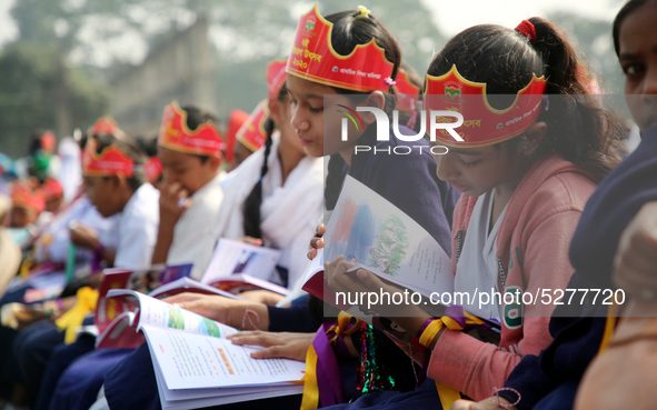 Bangladeshi Students receive free textbooks from government to celebrate on the first day of the New Year in Dhaka on January 1, 2020. The B...