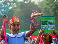 Bangladeshi Students receive free textbooks from government to celebrate on the first day of the New Year in Dhaka on January 1, 2020. The B...