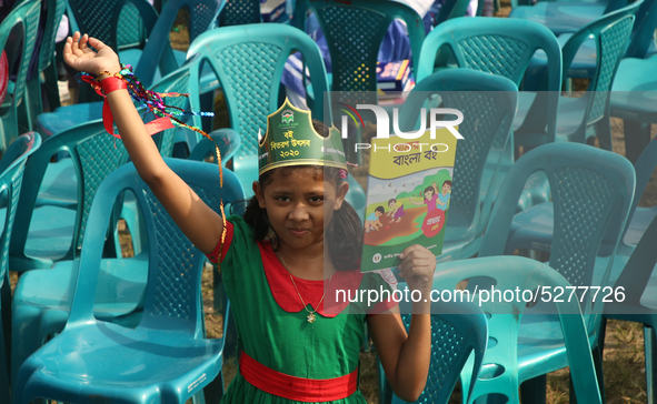 Bangladeshi Students receive free textbooks from government to celebrate on the first day of the New Year in Dhaka on January 1, 2020. The B...